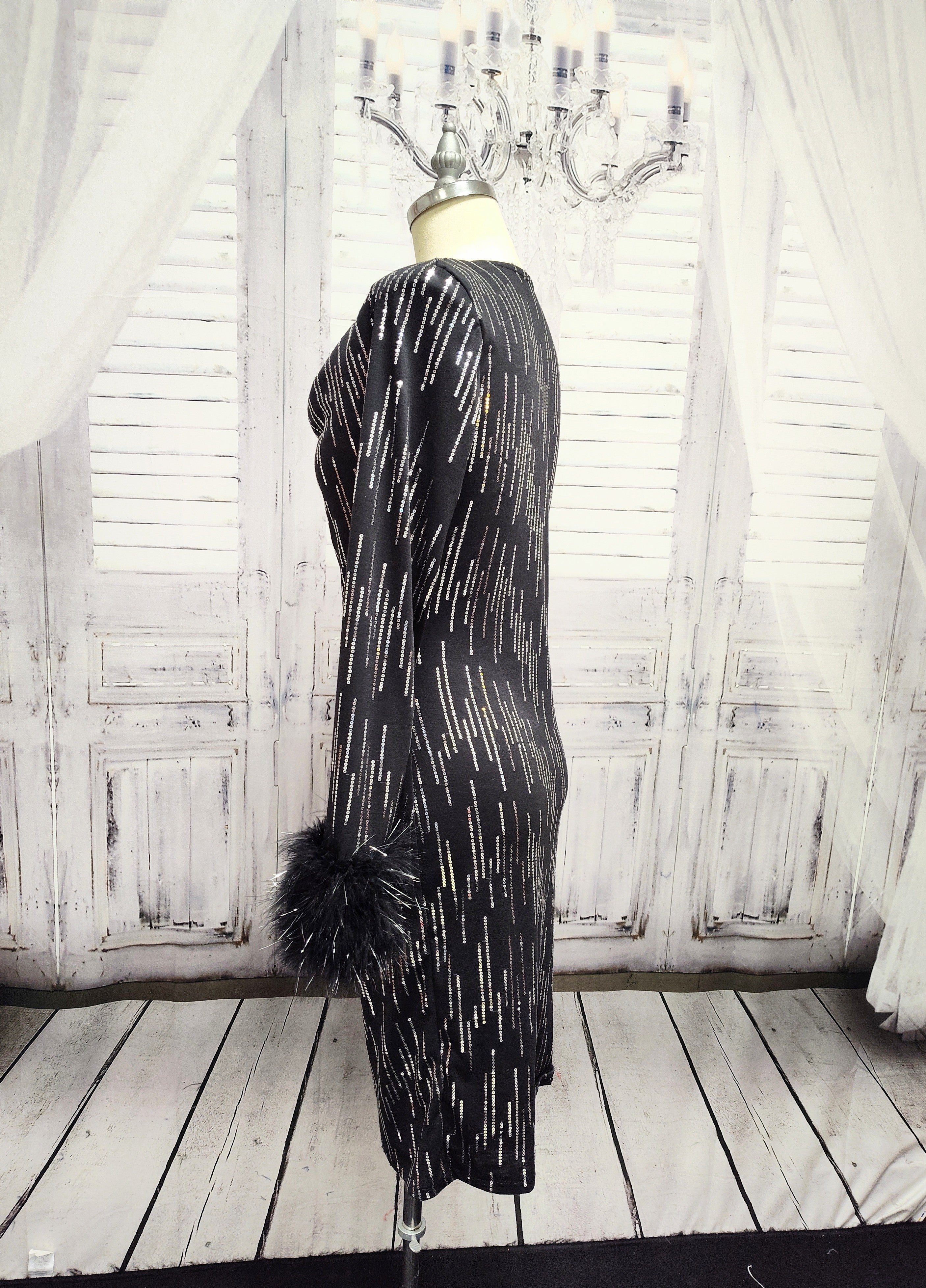 Black knit and silver sequin dress with feather cuffs