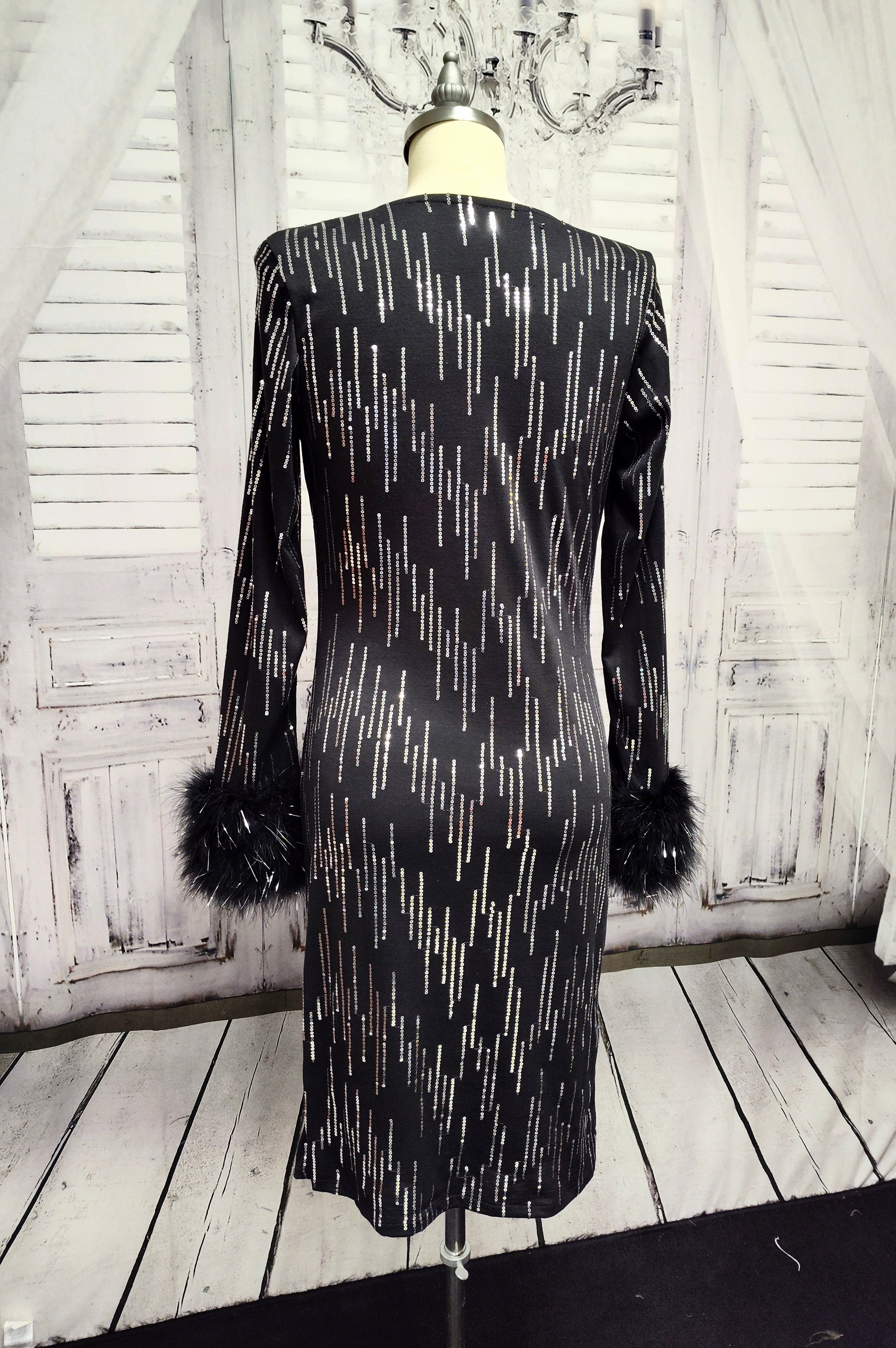 Black knit and silver sequin dress with feather cuffs