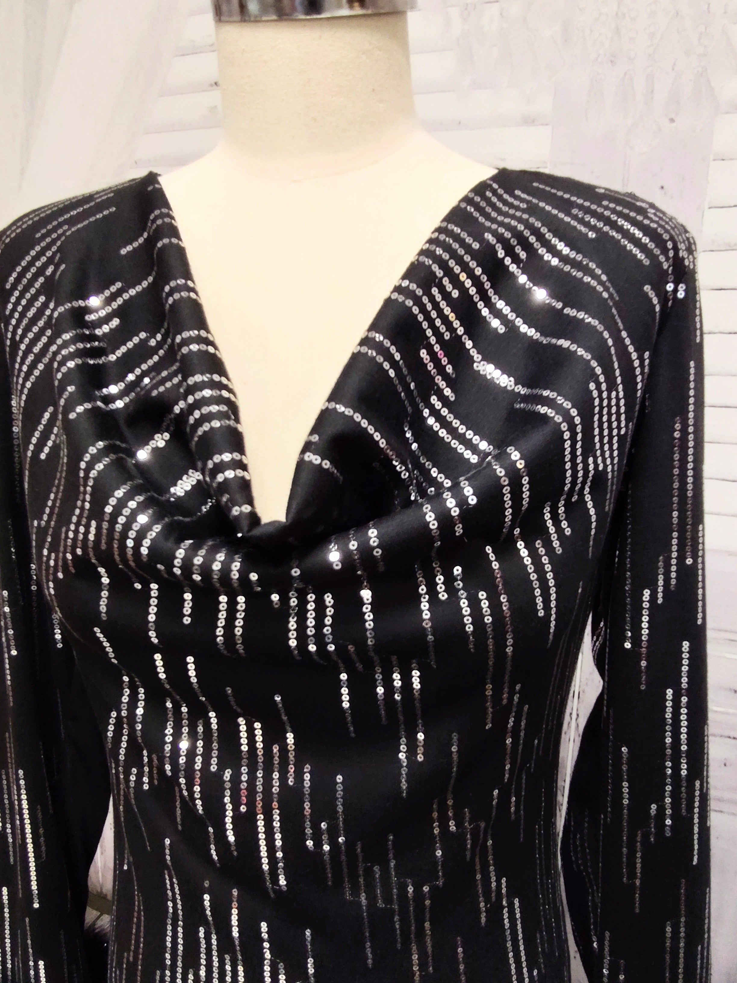 Black knit and silver sequin dress with feather cuffs
