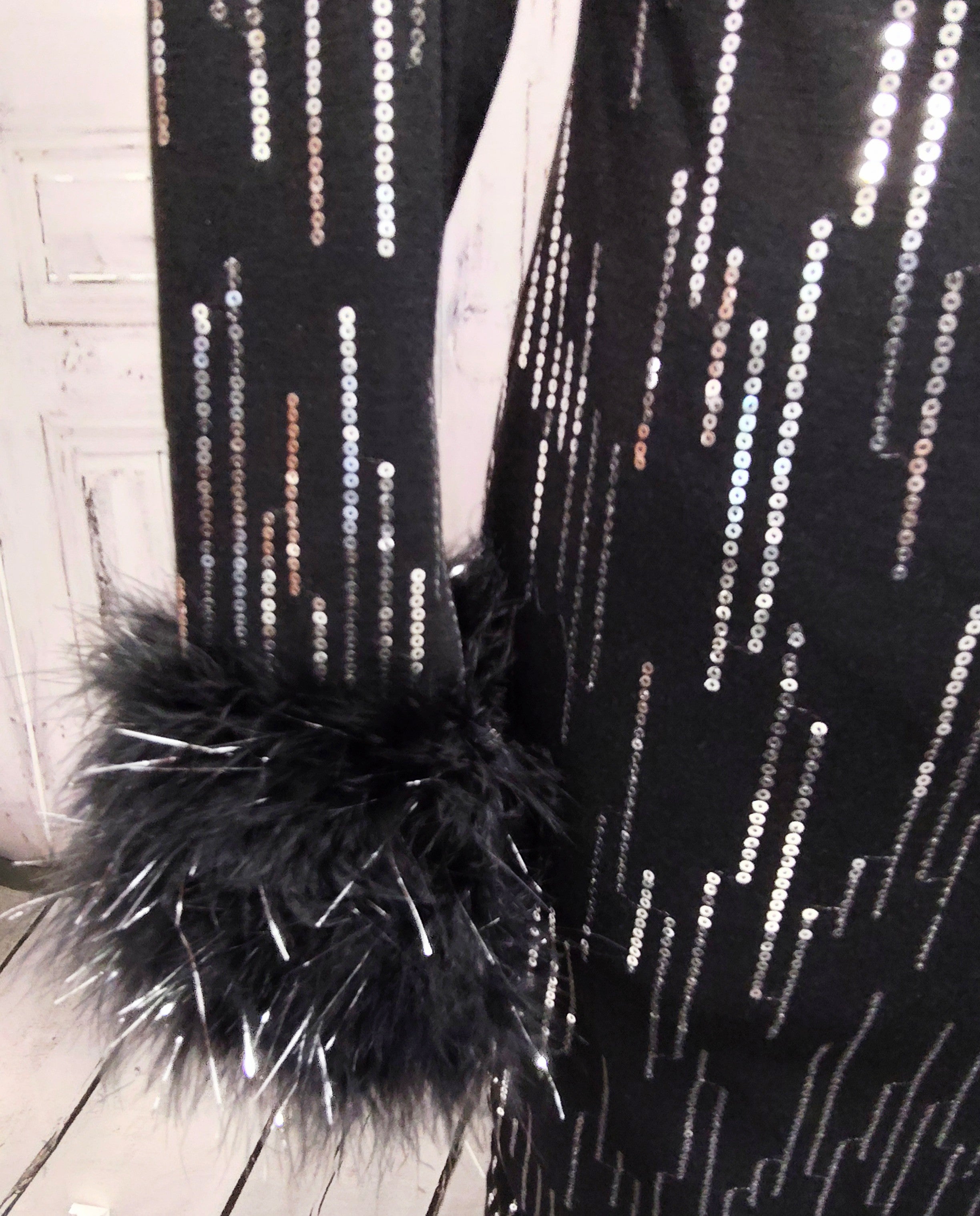Black knit and silver sequin dress with feather cuffs